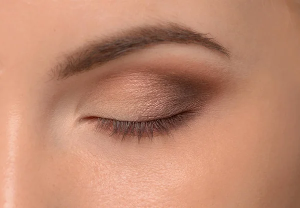 Eye with unfinished makeup — Stock Photo, Image