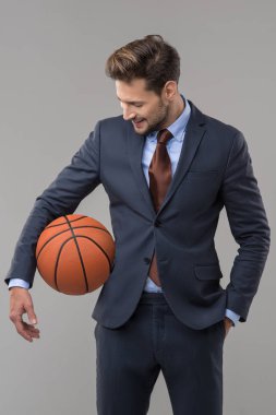 Elegant man with ball clipart