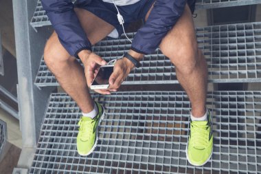 Jogger holding smartphone