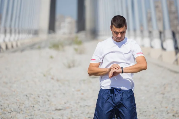 Runner checking his watch