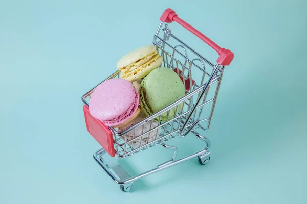 Macarons biscuits in shopping cart