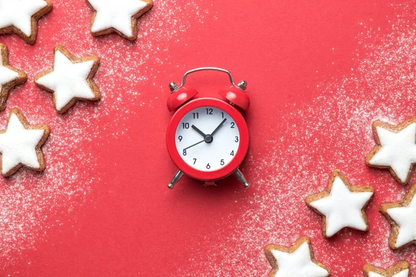 Holiday background made of star shape cookies and analog retro clock. — Stock Photo, Image