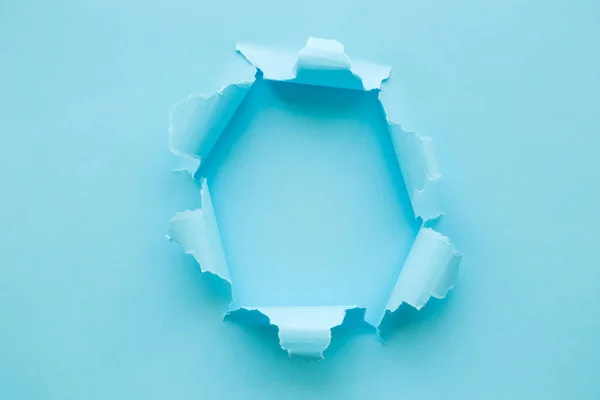 Breakthrough paper hole blue abstract. Space for copy. — 스톡 사진