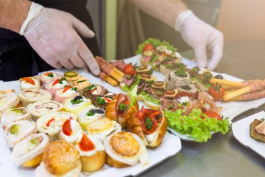 Buffet meal preparation and serving at restaurant.