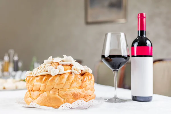 stock image Wine and decorated bread on table for celebration a saint in Orthodox faith. Serbian traditional and cultural heritage.