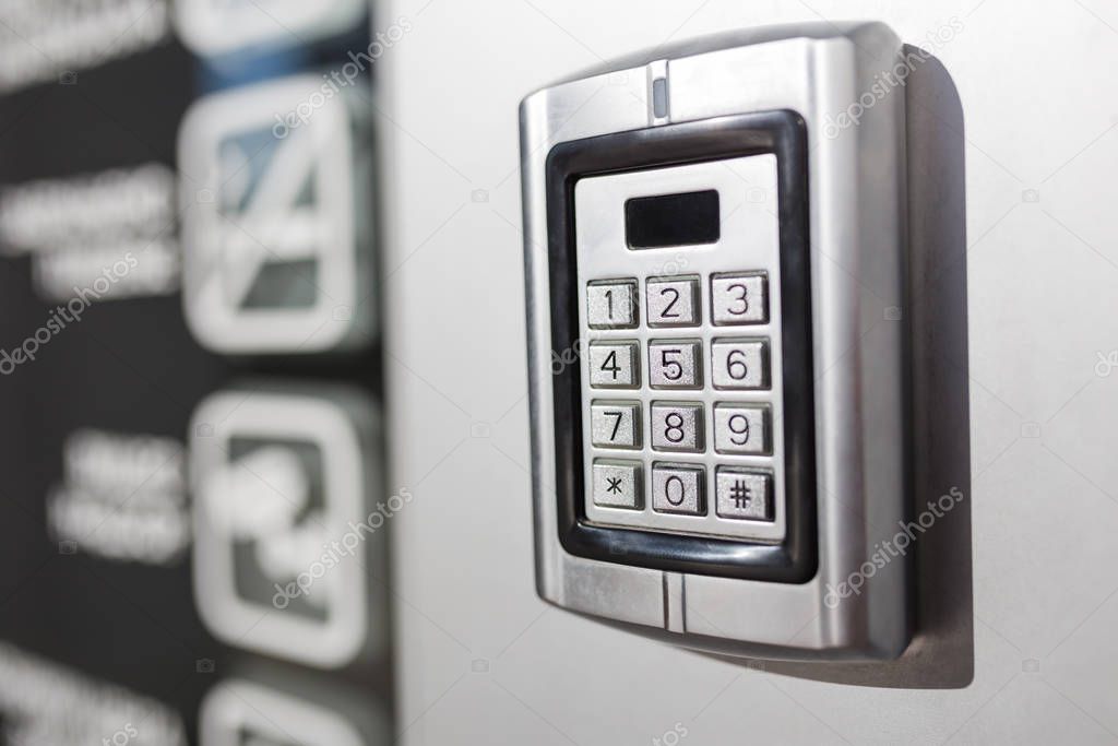 Metal intercom electronic access control door box with numeric keypad.