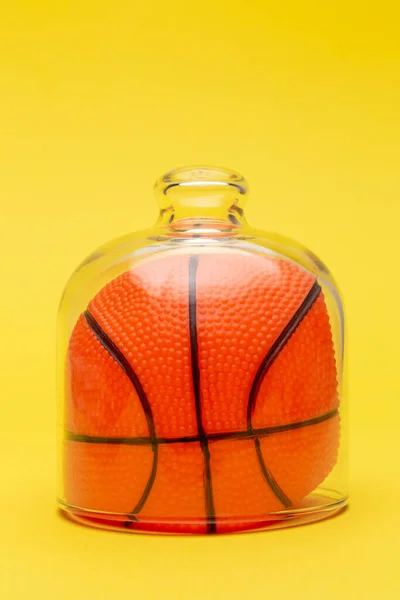 Basketball ball under glass cover isolation covid-19 abstract.