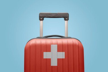 İsviçre bayrağı tasarımı bavulu Avrupa seyahati kavramı.