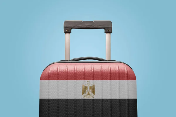 Suitcase with Egyptian flag design travel Africa concept.