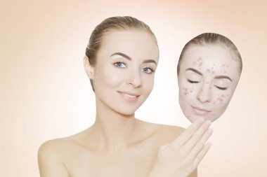 woman takes away mask with acne and pimples,pink background clipart