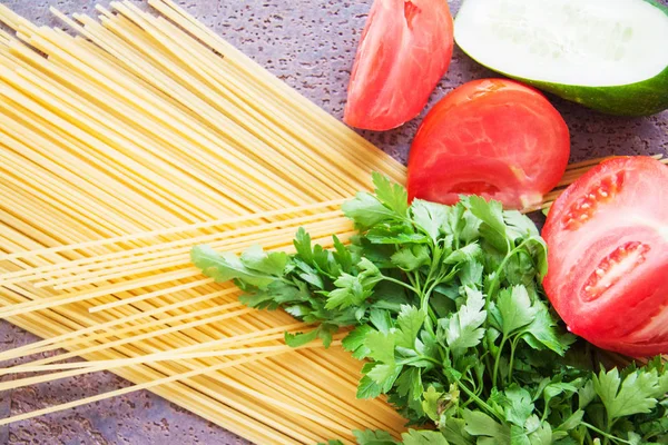 raw italian noodles spaghetti on table in kitchen