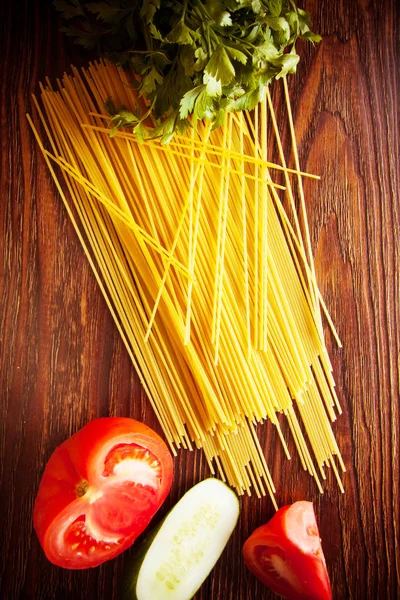 raw italian noodles spaghetti on table in kitchen