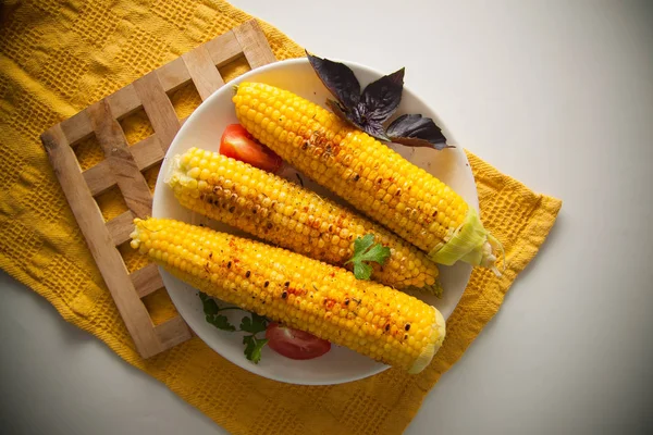 fried corn with herbs on plate