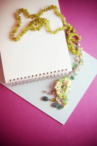 vintage colorful background with granny`s green necklace. Memori