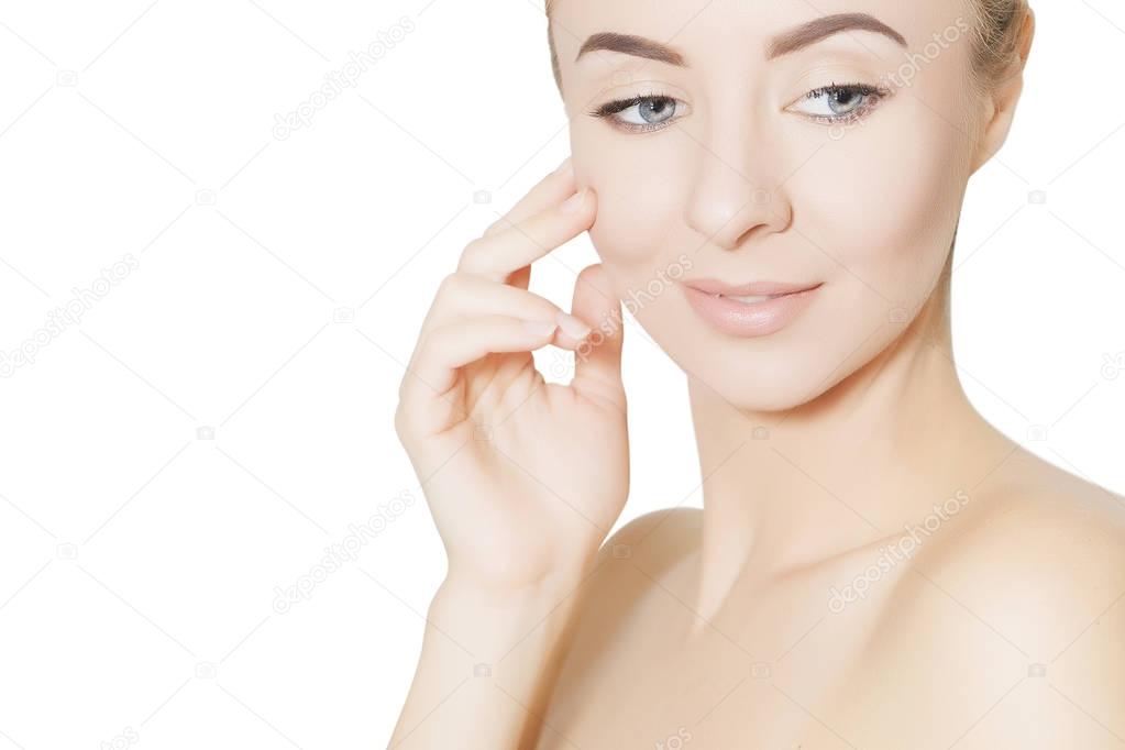 woman touches her face