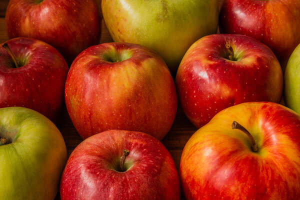 Red apples on wooden background