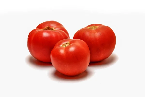 Rote Tomate auf weißem Hintergrund Stockbild