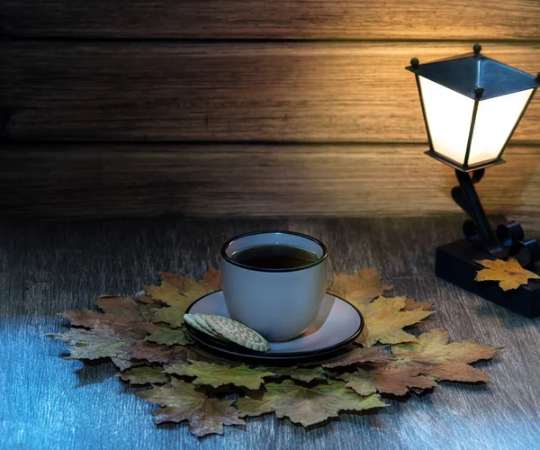 cup of fragrant tea on a wooden table against a background of au