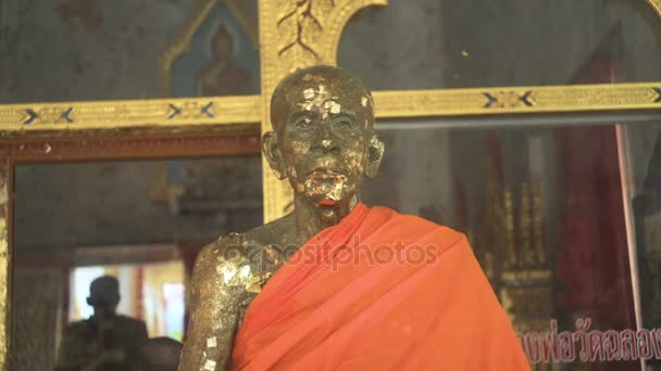 Aged Stone Statue Of Buddhist Monk — Stock Video