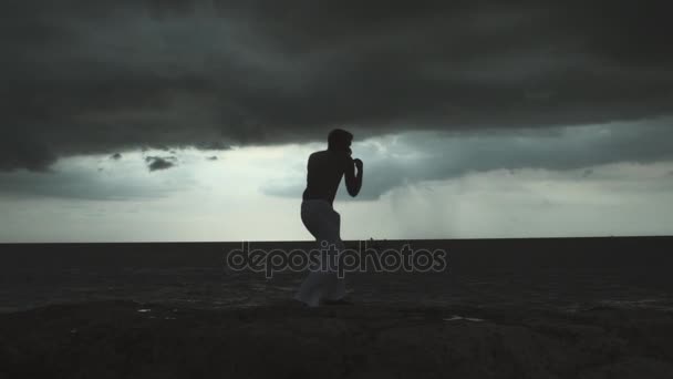 Young Man Training Martial Arts At Sunset — Stock Video