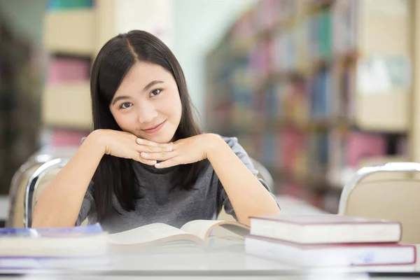 Woman reading a book in library — Stock Photo, Image