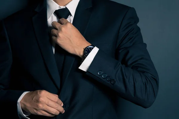 Businessman Adjusting His Necktie — Stock Photo, Image
