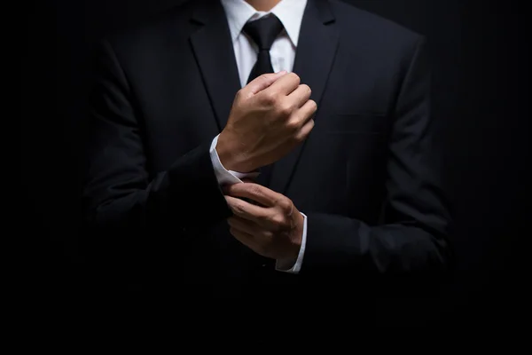 Businessman adjusting his cufflinks — Stock Photo, Image