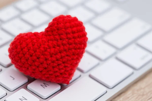 Stethoscope with red heart on keyboard Stock Image