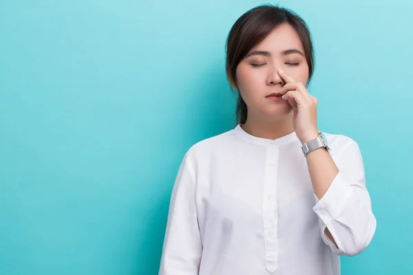 Woman touch her nose