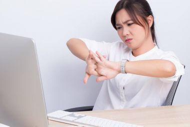 Woman has hand pain from work clipart