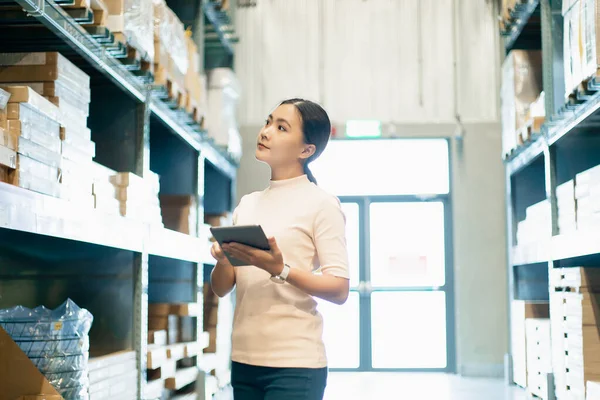 Woman shopping for furniture and using her tablet to compare pri