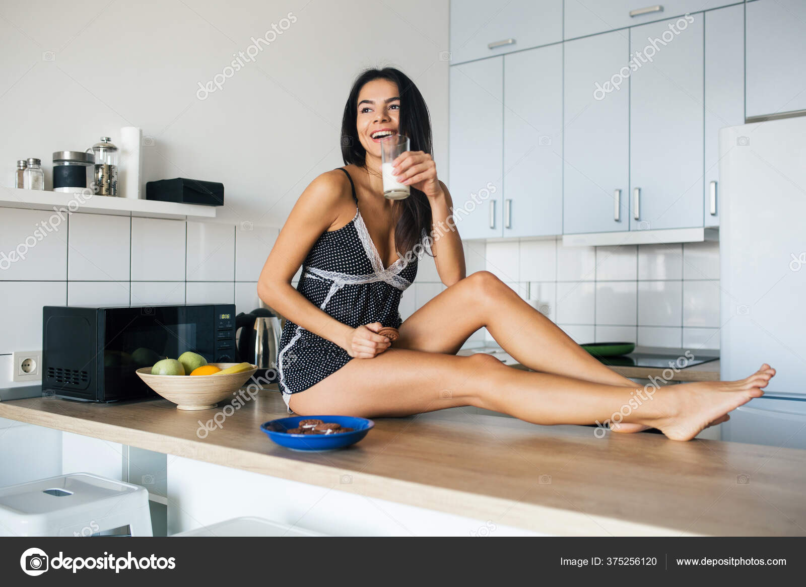Sexy legs cooking in the kitchen