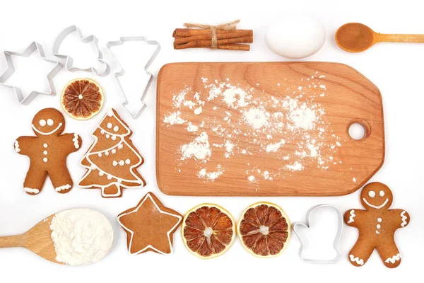 Creative winter time baking background. Kitchen utensils and ingredients for christmas homemade gingerbread cookies on white background — Stock Photo, Image