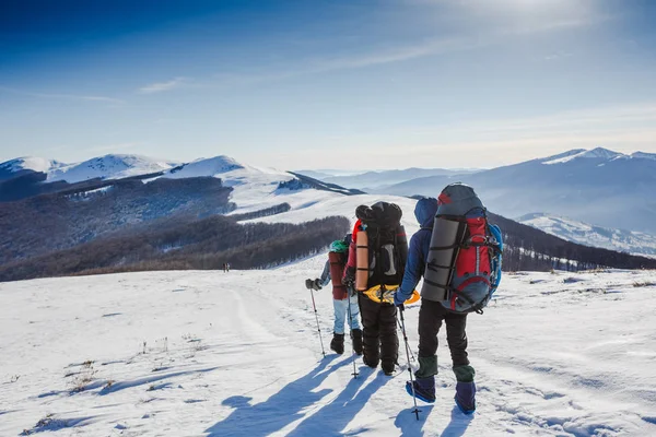 hiking in winter mountains. People traveling and sport concept