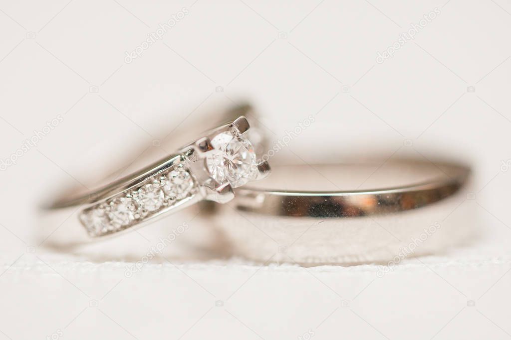 Wedding rings on white background 