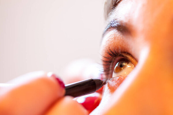 Applying Eyeshadow on a female