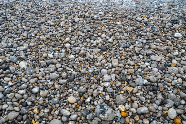 Закрыть брусчатку на пляже — стоковое фото