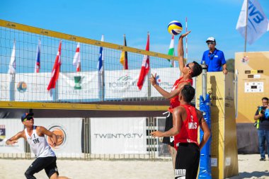lANGKAWI, MALAYSIA - 13 MARCH 2020: Al Rashid and Al Basri from Malaysia vs Wang C.J and Hsieh Y.J from china Taipei during day 2 of the FIVB Beach Volleyball World Tour Langkawi 2020 clipart