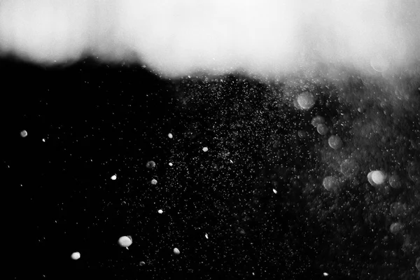 abstract white dust on black background