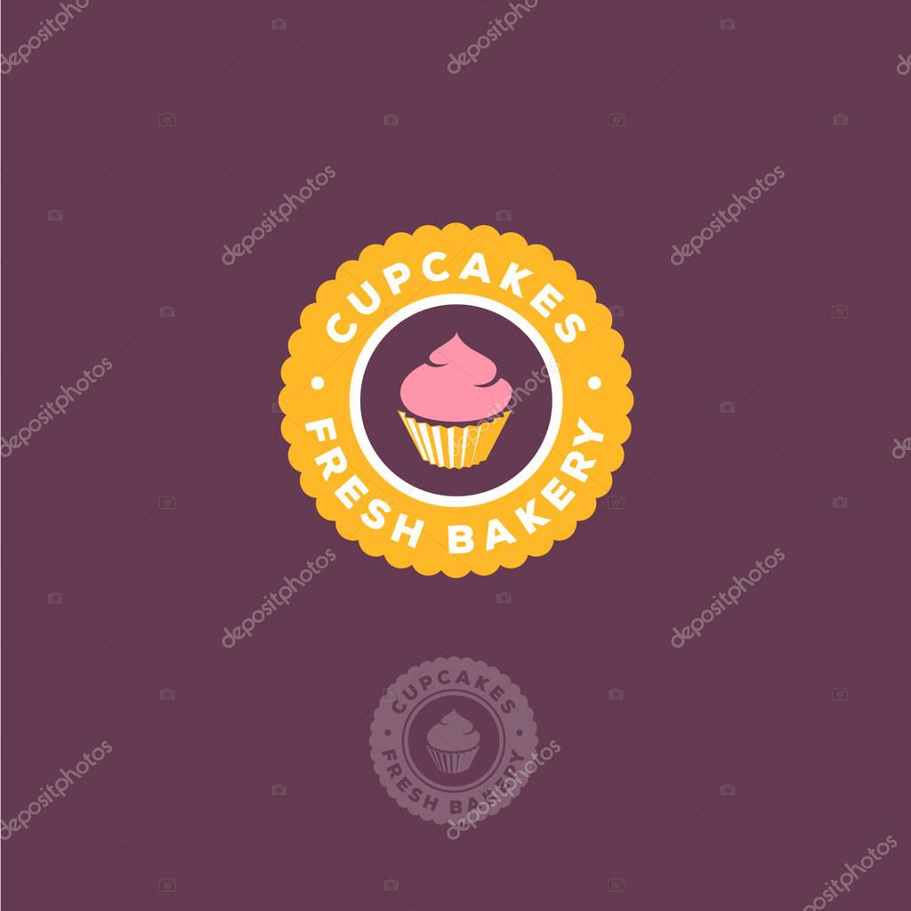 Cake with cream in a yellow circle with the letters.