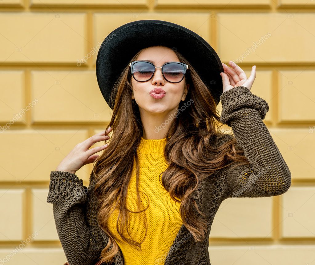 Fashion woman in a hat and sunglasses Stock Photo by