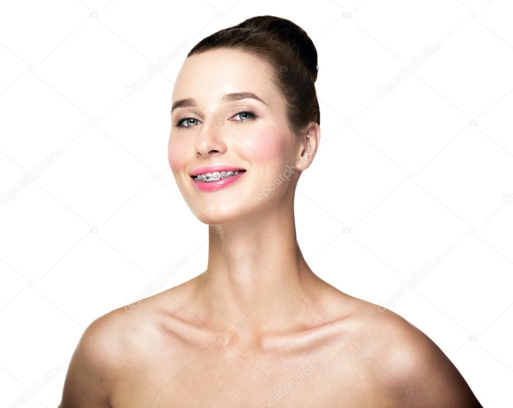 Beautiful young woman with teeth braces 