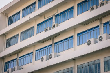 white facade and windows of an office building