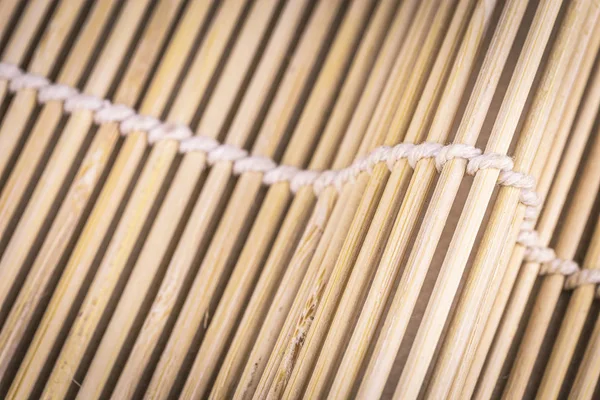 Closeup wooden bamboo straw mat for cooking sushi food asia