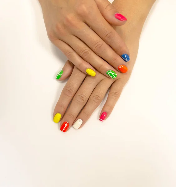 Multicolored manicure on white background — Stock Photo, Image