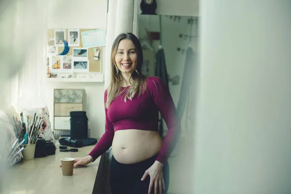 Pregnant Woman Drinks Tea Window She Wears Tight Sport Costume — Stock Photo, Image