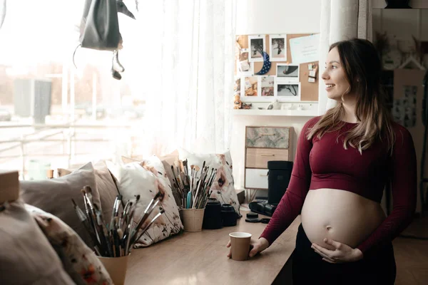 Pregnant Woman Drinks Tea Window She Wears Tight Sport Costume — Stock Photo, Image