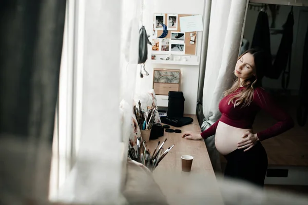 Pregnant Woman Drinks Tea Window She Wears Tight Sport Costume — Stock Photo, Image