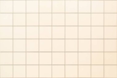 Dekoratif kare bej döşeme arka plan veya arka plan olarak binanın cephesinde