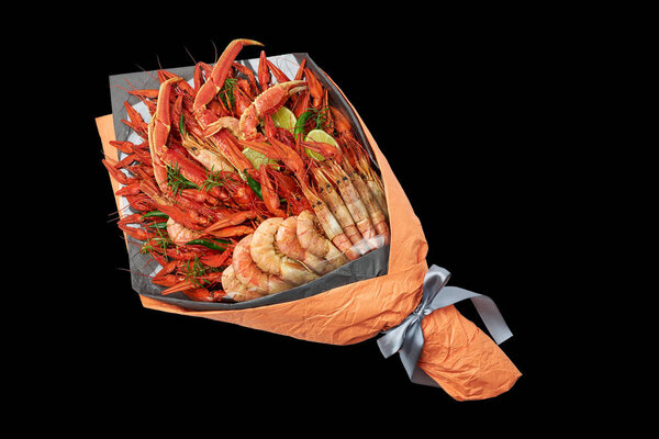 Snack for a youth party in the form of a bouquet with boiled crayfish, crabs and shrimps on a black background